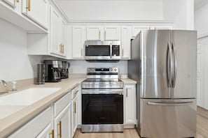 All new stainless steel appliances including coffee maker, blender and air fryer