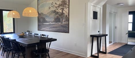 View of dining room, back entrance, and full bathroom.
