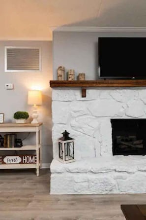 Electric log fireplace available year round!!