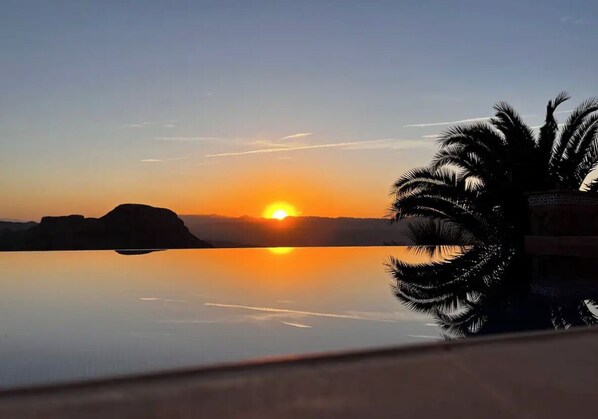 Sun setting over the private infinity pool. 