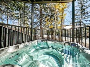 Step outside to discover the hot tub, where you can soak and unwind while enjoying the fresh mountain air and stunning views.