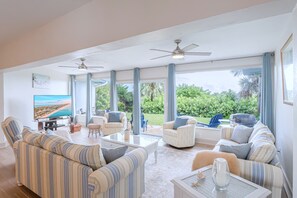 Living room with peeks of ocean over the horizon