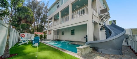 Swimming pool w/water rainfall feature & slide (heating available for $35/day*)