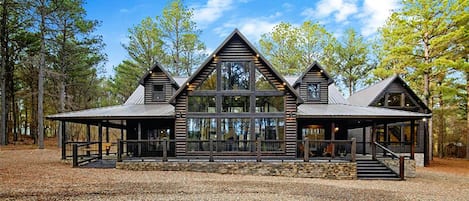 Welcome to The Ambiance!  This spacious cabin is set on an oversized lot with frequent deer sightings.  Featuring 3 King Suites, 1 Queen Suite, a main house bunkroom that sleeps 8 and a detached game room loft that sleeps 7, this cabin is perfect for your large group!