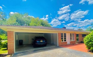 Rear view of house.  Access through keypad entry into sunporch.  Double garage.