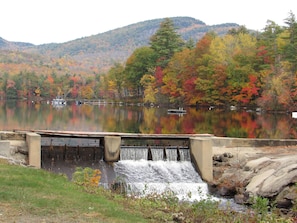 Fall foliage on lake keewaydin in Stoneham Maine.