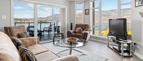 Unwind in this cozy living room with an amazing view of Okanagan Lake.