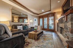 Living room with fireplace and queen sofabed