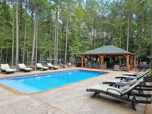 Pool Area With Seating and Pavilion-Outdoor Kitchen View