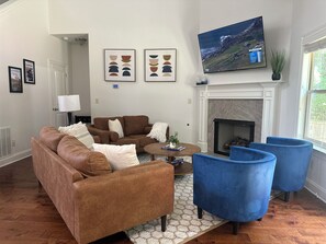 Relax on the cozy sofa as you unwind while watching a game or movie.