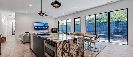 Kitchen Island with full view of living area and private pool