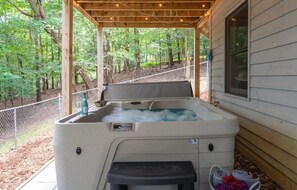 New hot tub with cover lift to relax and enjoy the outdoors.