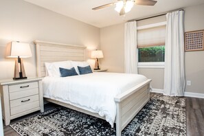 Secondary bedroom with queen bed and bathroom suite. 