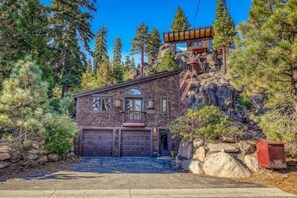 An exterior shot of this one-of-a-kind home. The studio is located above the detached garage providing a nice separation from the main house.