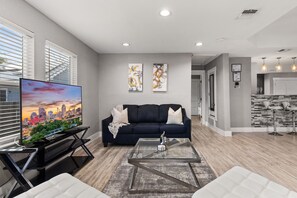 Living Room: Plenty of seating in the living room to watch a movie or show.