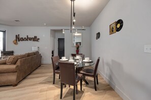 Dining space equipped to accommodate four individuals.