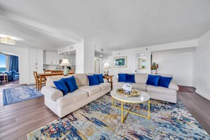 Your Living Space is Filled With Plush Couches and Coastal Touches That Echo The beach Outside!