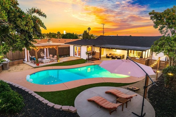 Your own retreat awaits - soak up the sun in your private pool area with cozy cabana loungers.