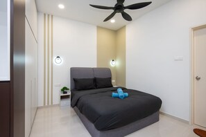 The 1-bedroom unit features a queen-sized bed, an en-suite bathroom, and a single-sized floor mattress in the living area.