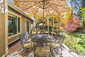 Outdoor seating offers alfresco dining on your private porch overlooking your large grassy yard.