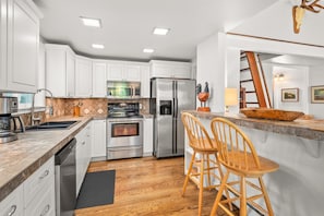 Renovated, fully-equipped kitchen with updated appliances.