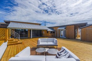 Soak up the sun on the private rooftop couches!