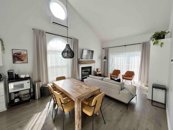Dining room and living room with Queen wall bed