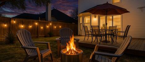 Unwind by the firepit in this inviting backyard, perfect for long-term insurance stays. After a day of shopping at nearby Sprouts or dining at Brasao Brazilian Steakhouse, relax in the comfort of this peaceful outdoor space.