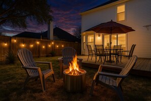 Unwind by the firepit in this inviting backyard, perfect for long-term insurance stays. After a day of shopping at nearby Sprouts or dining at Brasao Brazilian Steakhouse, relax in the comfort of this peaceful outdoor space.