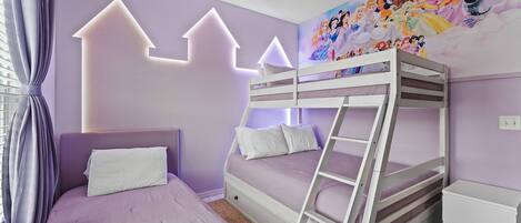 Kids will fall in love with this Princesses-themed bedroom with a bunk bed and one twin bed!