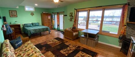 This is the view from the kitchen sink/bathroom doorway area.  Such a cute space.  And check out that lake view.  You can also see the patio and picnic table out there.  Start making plans!