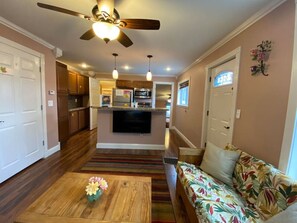 This is a view from the couch.  The TV is right there for your entertainment and you can see the kitchen, bathroom door, and bedroom door as well.  This is super convenient to chat while cooking.