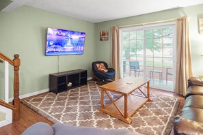 Living Room with 65in Smart TV and Access to Outdoor Space