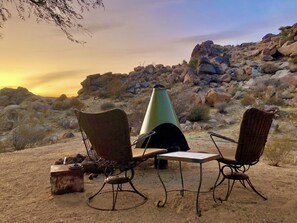 west side outdoor seating, cone firepit from 1972 original interior