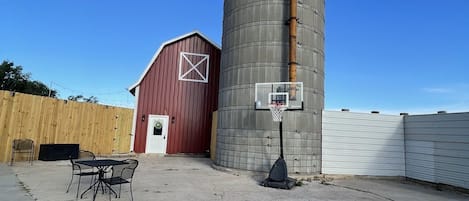 Enjoy the beautiful barnyard patio right beside the silo.  The patio where cows used to lounge and chew their cud. The silo used to hold feed for the cows and the barn used to house cows and horses for the night.