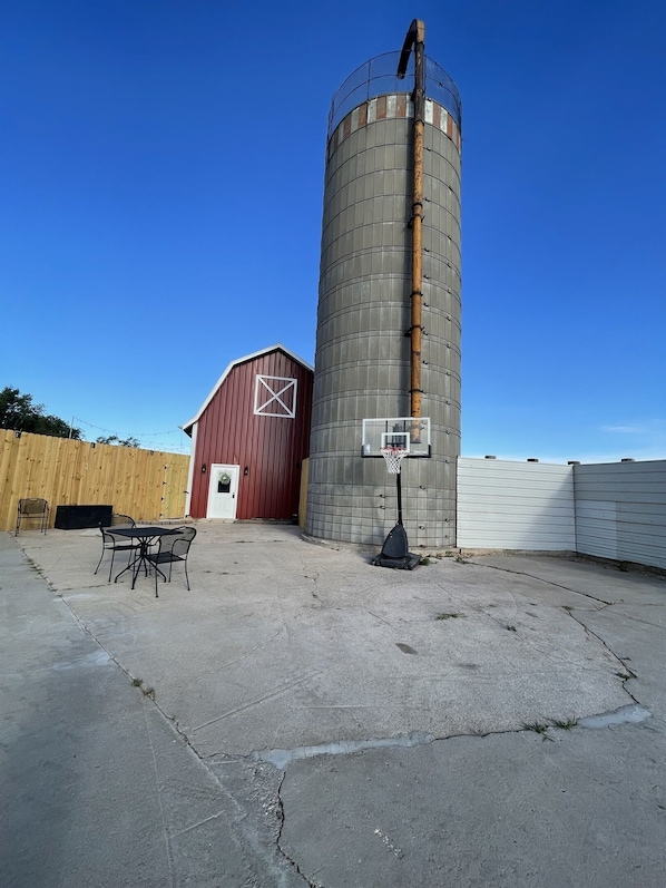Enjoy the beautiful barnyard patio right beside the silo.  The patio where cows used to lounge and chew their cud. The silo used to hold feed for the cows and the barn used to house cows and horses for the night.