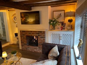 Living room with Sky TV, open gas flame fire, 2 sofas, remote lighting, very warm and cosy! 