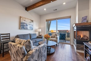 Beautiful sitting area to cozy up to the fireplace or catch a football game.