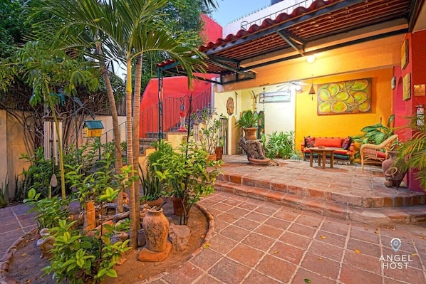 On the ground level, you’ll find a wonderful garden patio that’s shared with the other rooms