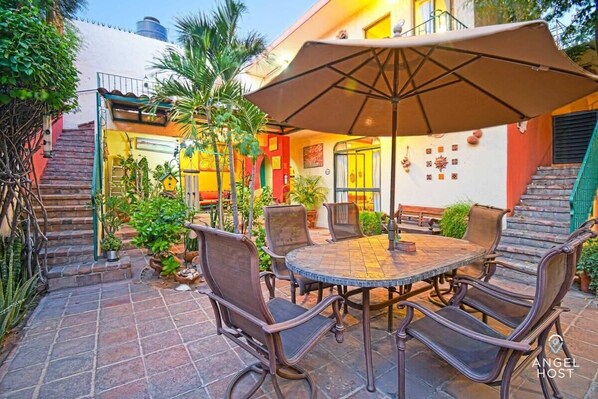 Here you can enjoy a meal or just hang out at the table shaded by a large umbrella