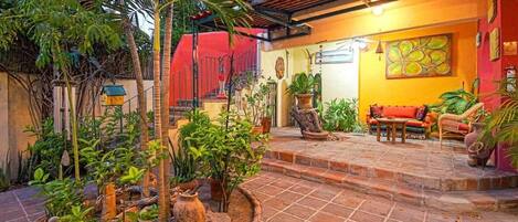 On the ground level, you’ll find a wonderful garden patio that’s shared with the other rooms