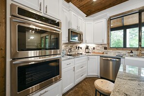 The well-appointed, beautiful kitchen is perfect for cooking a family meal. 