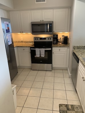 Kitchen features all-new stainless appliances and Keurig and drip coffeemakers.