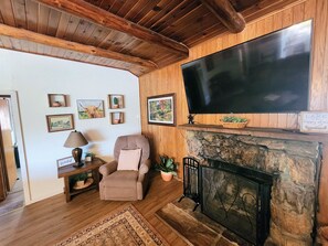 Wood Burning Fireplace with 65" TV