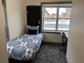 Twin bed and desk.