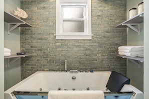 Soak in the jetted tub with chroma-therapy (aromatherapy bath salts included)