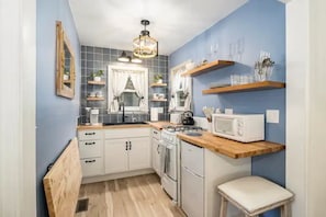 Enjoy many upscale and unique features of the fully-equipped tiny kitchen 