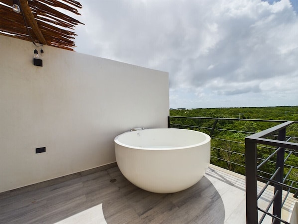 The view of the Tulum jungle from up there is absolutely stunning. You will surely love a private moment on the terrace in your own jacuzzi.