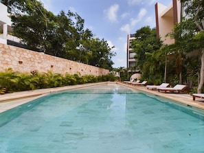 The residence Chaac also offers outstanding amenities for our guests such as this beautiful swimming pool with plenty of sundecks