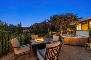 Gather 'round the fire pit with family and friends while enjoying picturesque sunsets